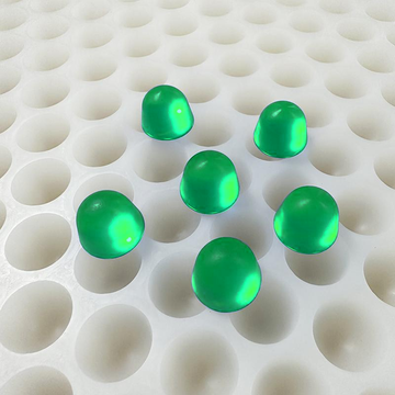 3mL round dome gummy mold with 168 cavities and six emerald green gummies