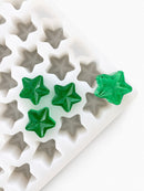 4mL star gummy mold with 168 cavities and emerald green star gummies on a white background